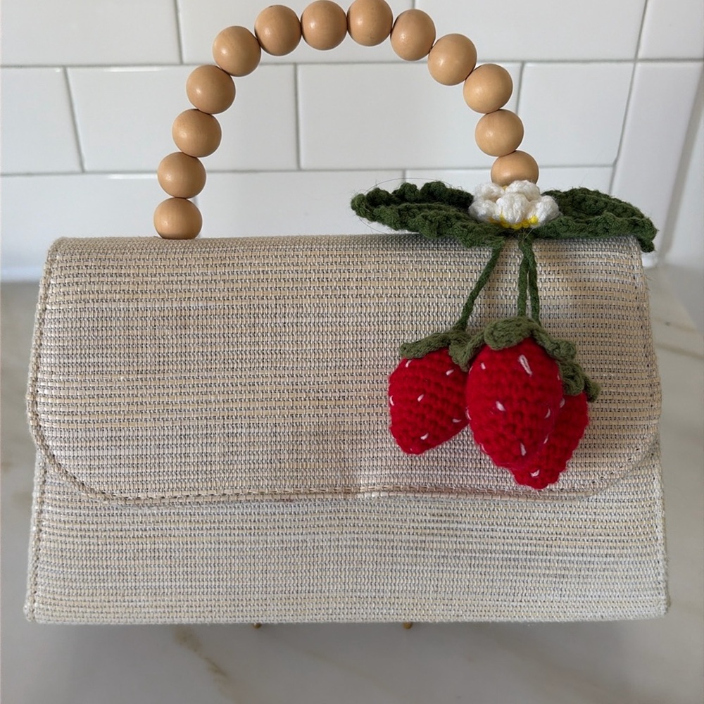 Handbag with decorative crocheted strawberries. 🍓
